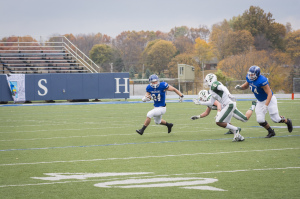 A Charger football player on the field. Collegian. 