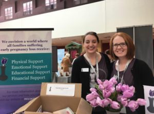 EPLA Secretary Maria Servold and President Emily Carrington at a pregnancy and infant loss conference in 2018.