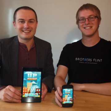 Cory Flint '14 and Toby Flint '13 pose with their Up & Away game.