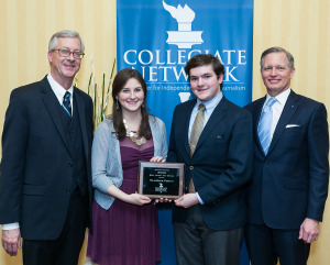 Juniors Meg Prom and Chris McCaffery stand with Collegiate Network President Chris Long and Director of Leadership Development John Elliott and their second award in four years for best design from the Collegiate Network.  (Courtesy of the Collegiate Network)