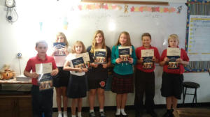 Fifth-grade students with their new Latin books at Hillsdale Preparatory Academy. Daniel Negri | Courtesy