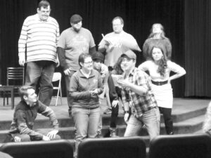 Members of the cast of ‘M.A.S.H.’ rehearse in Phillips Auditorium. | Courtesy Sauk Theatre Facebook page