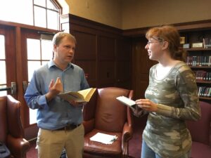 Assistant Professor of Physics Timothy Dolch discusses science fiction with sophomore Ilsa Epling at last Thursday’s Conversation. Madeleine Jepsen | Collegian