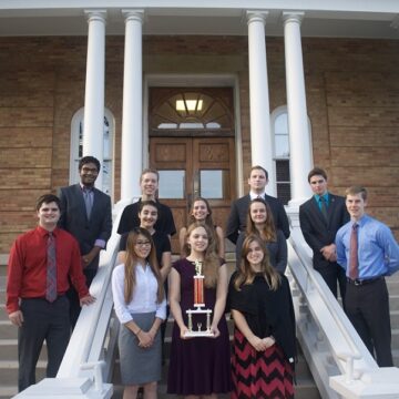 Debate finishes first at opening competition