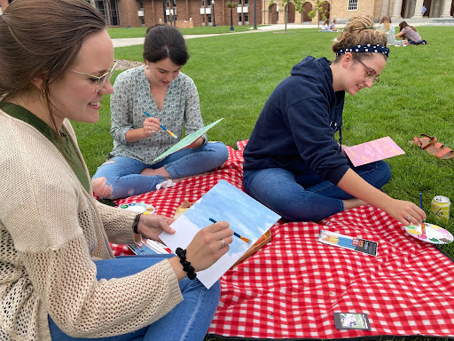 Students escape stress at picnic and painting event