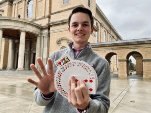Junior Jack Hammons wields a deck of cards. Collegian | Tracy Wilson