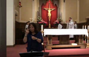 Susan Shirk interprets a Mass at St. Anthony’s. Courtesy | Susan Shirk