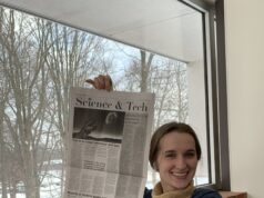 Victoria Marshall holds the Science & Tech section of the Collegian. Courtesy | Ben Wilson