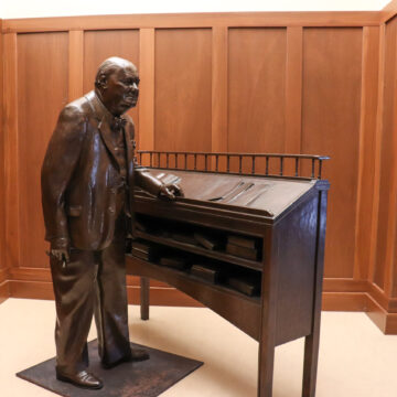 A statue of Winston Churchill stands on the Liberty Walk in the Grewcock Student Union. Olivia Pero | The Collegian
