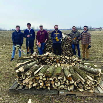 Catholics chop wood for families in need