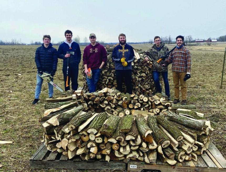 Catholics chop wood for families in need