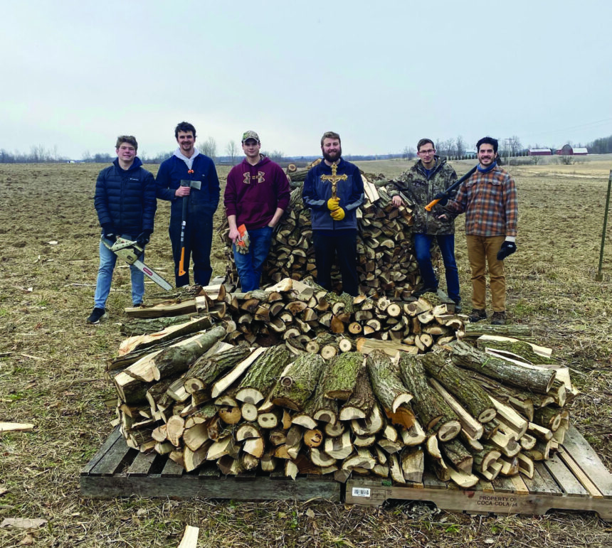 Catholics chop wood for families in need