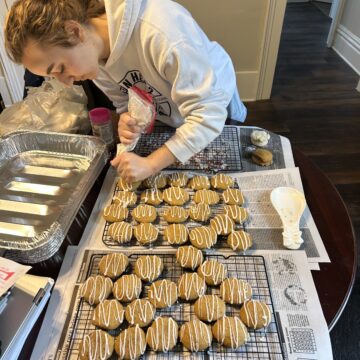 Students exchange textbooks for oven mitts in preparation for Maker’s Market